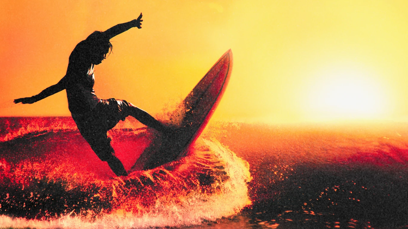 Surfer silhouette at sunset