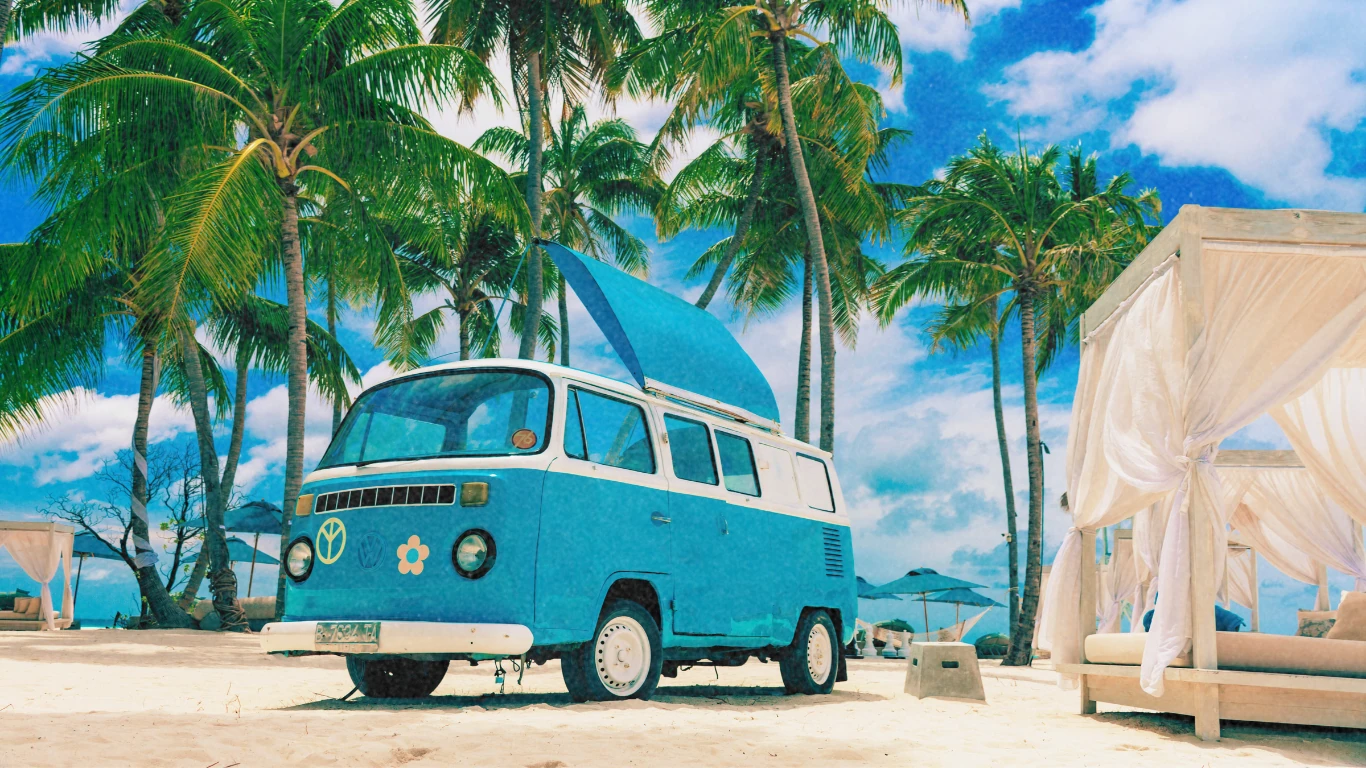 Turquoise van on a tropical beach